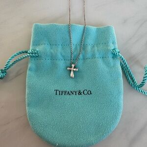 Tiffany and Co. Elsa Peretti silver cross necklace.